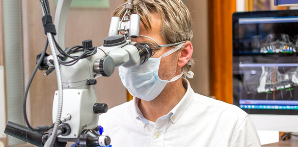 Robert Jenkins using a microscope